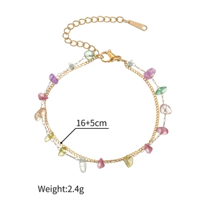 Detail of 18K gold stainless steel layered bracelet with colorful natural stones