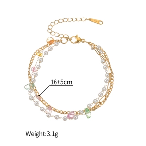 Detail of 18K gold stainless steel triple-layer bracelet with colorful stones and pearls