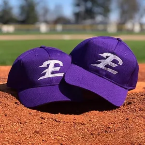Close-up of high-quality white embroidery on purple breathable mesh baseball caps