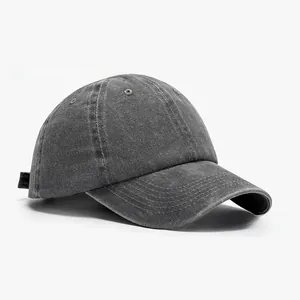 Detail of dark grey washed cotton baseball cap featuring adjustable strap and six-panel crown