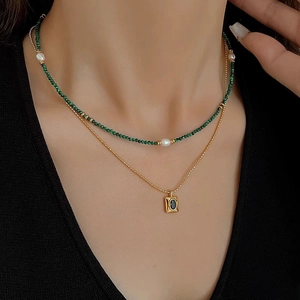 Double-layered malachite and pearl necklace with a vintage emerald zircon gold pendant