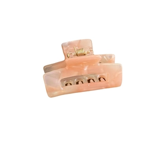 Elegant rectangle acetate hair claw clip with pink marble texture and gold metal spring