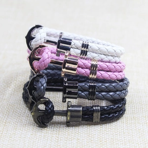 Detailed macro of four braided anchor bracelets in white, pink, grey and black colors