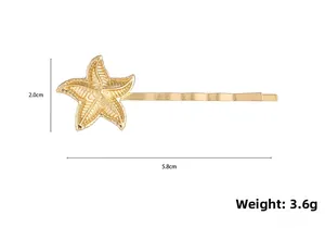 Détails et dimensions de la barrette étoile de mer dorée de 5,8 cm avec texture métallique