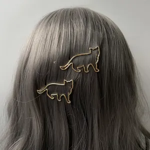 Ensemble de pinces à cheveux chat évidé doré pour femme sur cheveux bouclés