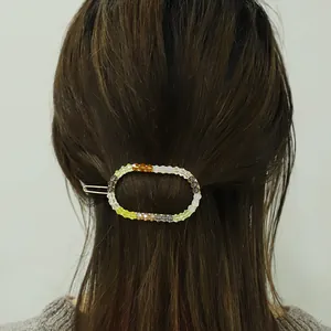 Colorful beaded oval hair clip with vibrant translucent beads on silver metal barrette