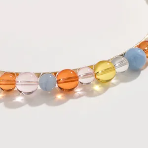 Colorful beaded headband with multi-color glass beads on a gold metal base