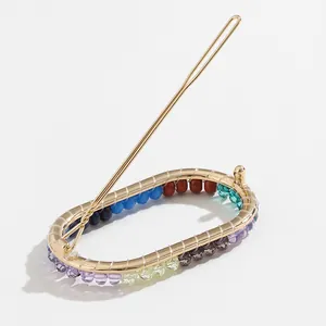 Handcrafted colorful beaded oval hair clip with gold metal frame for summer styling