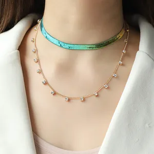 Double-layered gold necklace set with gradient herringbone chain and zircon pendants