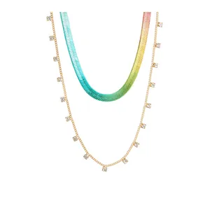 Detail view of stacked necklace set with gradient snake chain and crystal pendants