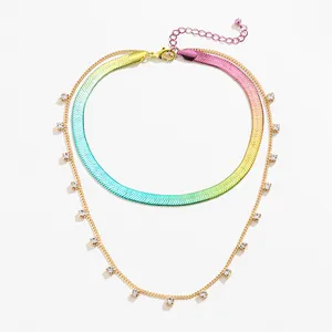 Double-layered necklace featuring a rainbow gradient herringbone chain and gold rhinestone link