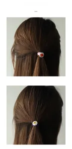 Detail of floral printed charms on pink and purple elastic hair ties for women