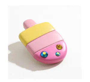 Close-up of resin popsicle hair clip with three-color gradient and sparkling rhinestones