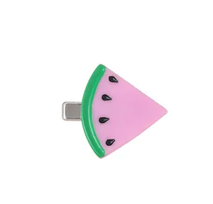 Detail of cute resin watermelon popsicle hair clip with pink flesh and green rind