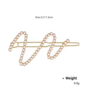 Elegant wavy gold hair clip with white pearls, size 3.5x7.3cm and 6.9g weight