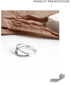 Macro detail of S925 sterling silver stamp on vintage double-layered beaded twist ring