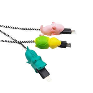 Three animal cable bites including axolotl, turtle, and crocodile on braided USB cables