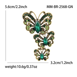 Vintage gold butterfly brooch with green rhinestones for coats and suits 5.6cm