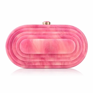 Detail of pink acrylic evening clutch with marble texture and golden snap closure
