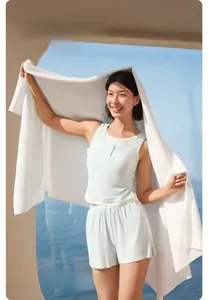 Close-up of white honeycomb texture on thick, absorbent disposable bath towel