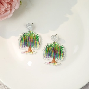 Close-up of artistic acrylic tree earrings with colorful hand-painted floral details