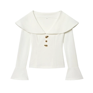 Detail of white blouse with large sailor collar and irregular gold metal buttons