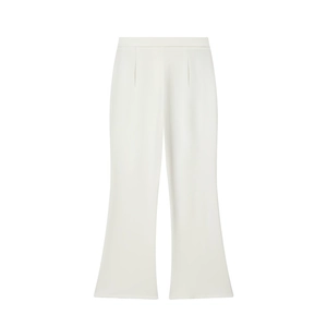 Detailed view of white high-waisted flared trousers with elegant draping fabric texture