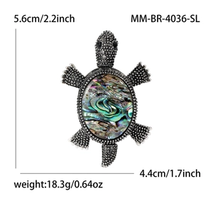 Vintage sea turtle brooch with rainbow abalone shell and silver textured metal finish
