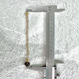 Length measurement of golden cup chain keychain with letter A charm and lobster clasp