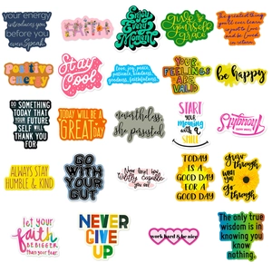 Close-up of 24 waterproof motivational quote stickers with vibrant colors and white outlines