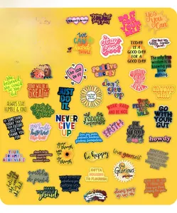 Flat lay view of 50 inspirational waterproof stickers with colorful cartoon designs
