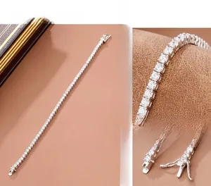 Close-up of four-prong tennis bracelet showing sparkling cubic zirconia and secure box clasp