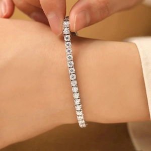 Sparkling tennis bracelet in silver finish with single row cubic zirconia on wrist