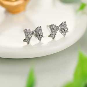 Sparkling S925 silver bow stud earrings with full zircon micro-pave for women