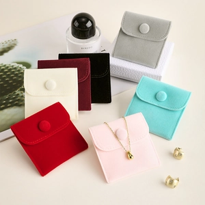 Velvet jewelry pouches in macaron colors with snap closure and elegant envelope design