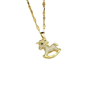Close-up of golden rocking horse pendant with sparkling white zircon pave on bead chain