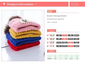 Detail view of thick knitted baby hats in four colors with faux fur pom poms and V patch