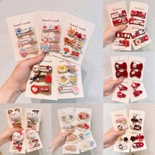 Detailed view of handmade plush hair clips and headbands with cute animal designs