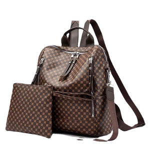Classic brown patterned vintage backpack and matching clutch set with silver zippers