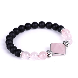 Matte black agate beaded bracelet with a pink crystal pyramid focal point and silver accents