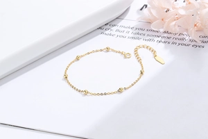 Detail of adjustable S925 sterling silver beaded bracelet with lobster clasp and tag
