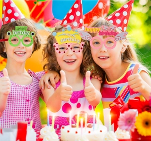Close-up of kids wearing cartoon animal birthday party glasses with Happy Birthday slogans