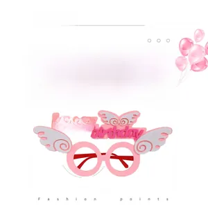 Close-up of pink Happy Birthday party glasses with soft white wings and felt texture
