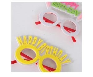 Close-up of Happy Birthday party glasses made of felt fabric and plastic frames