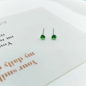 Elegant 925 silver stud earrings with four-prong round green zircon gemstones