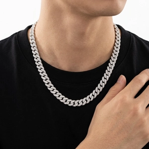Moissanite Cuban link necklace in silver finish with pavé set stones on male model