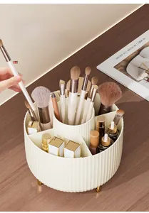Detailed top view of a cream white rotating makeup organizer with six storage compartments