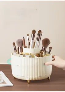 Close-up of 360-degree rotating makeup organizer with gold feet and divided sections