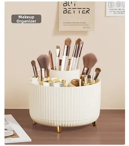 Rotating makeup brush organizer with vertical stripes and golden spherical feet details