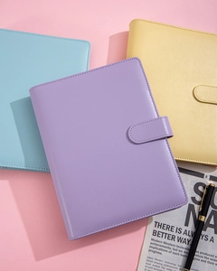 Detail of A5 macaron leather binder showing magnetic closure and fine stitching textures